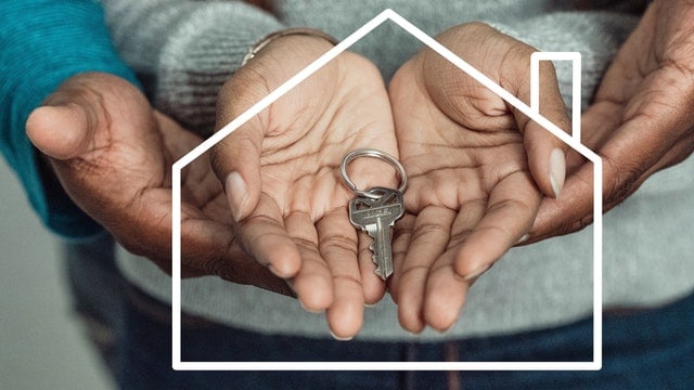 A couple holding a home key