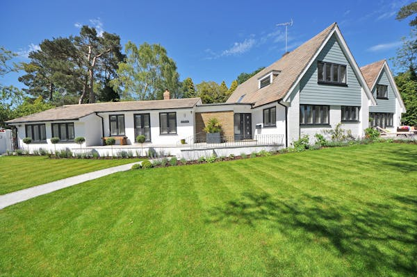 house with green lawn