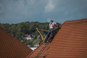 roofer on red roof