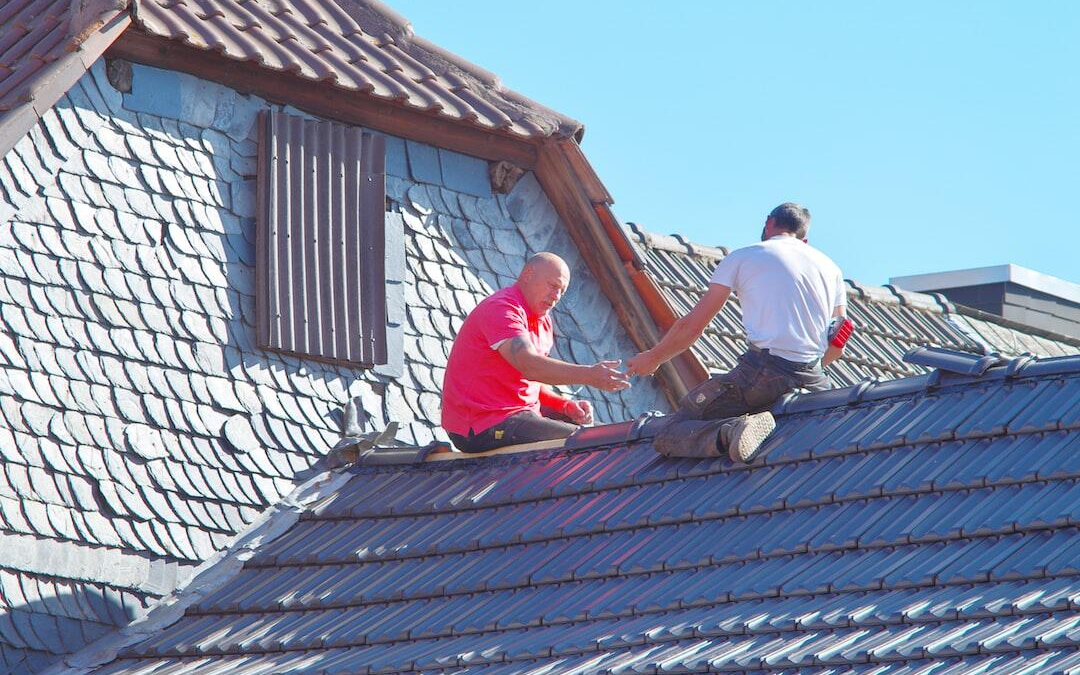 men working on roof