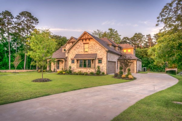 home with green grass and driveway