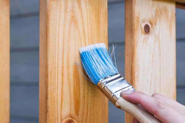 Painting wood with paint brush