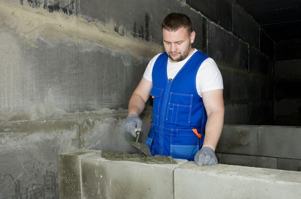 man doing masonry work