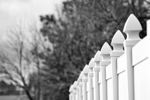 black and white photo of vinyl fence