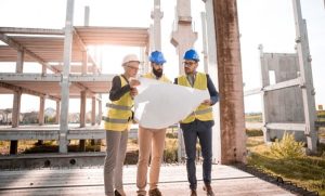 construction workers looking at blueprint