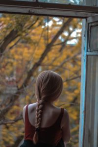 girl looking out window