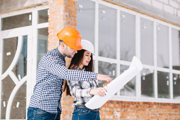 contractors reviewing blueprints