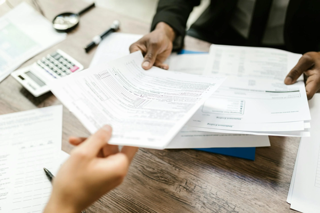 two people with paperwork