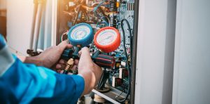 a person holding a pressure gauge