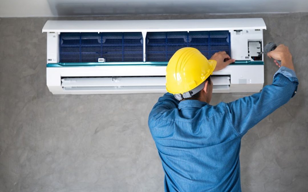 a person working on air conditioner repair