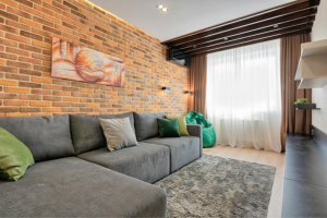 terracotta style wall with gray furniture