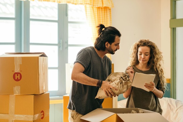 couple with a lot of moving boxes