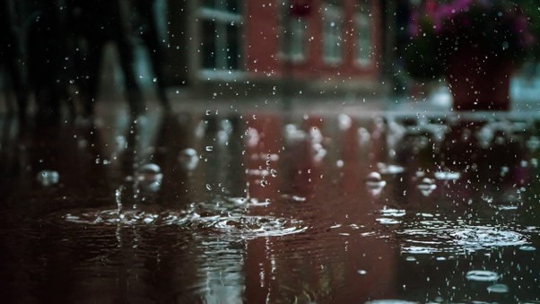 raining into puddle