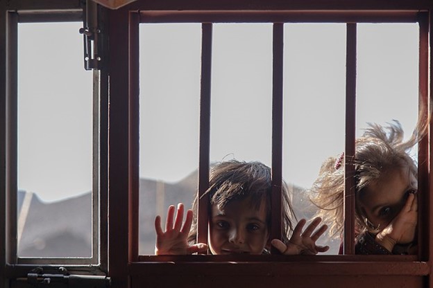 children looking out window