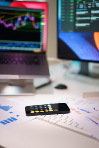work laid out on a desk with computer