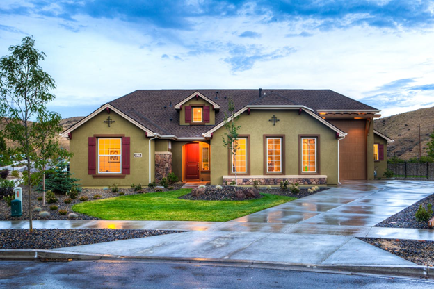 house with wet driveway after rain