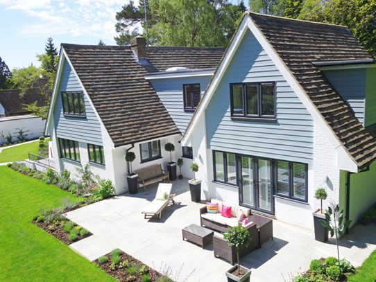 bakyard of home with nice patio and furniture outside