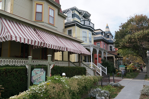 large porch with red and white striped fabric awning