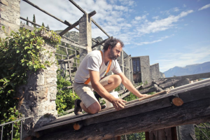 man looking at roof