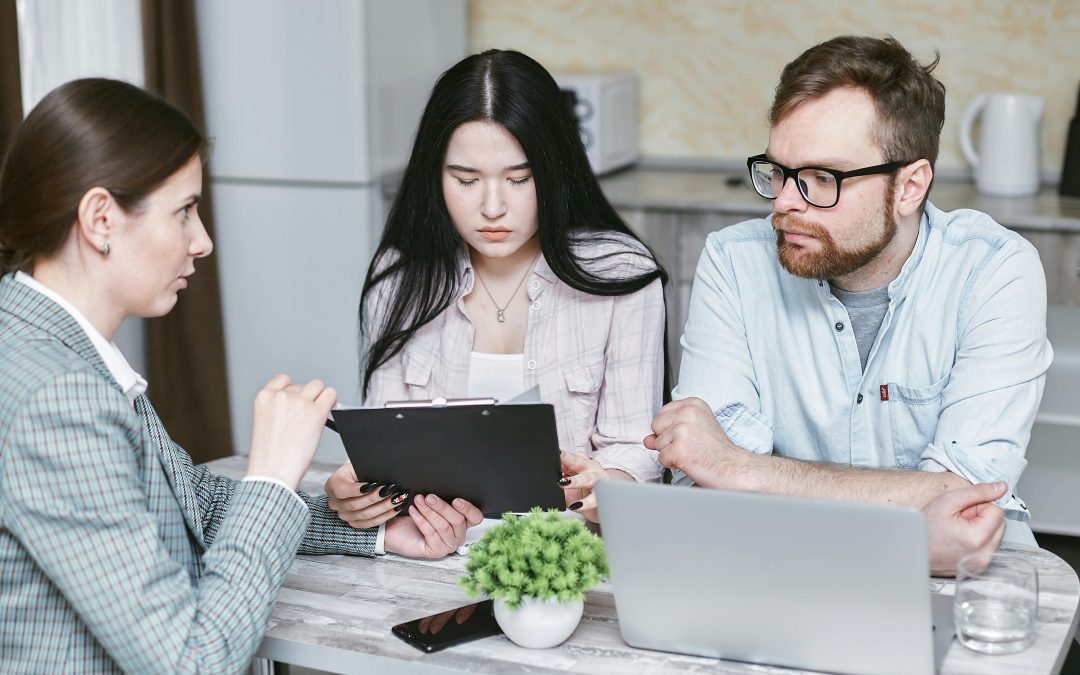 couple meeting with real estate agent