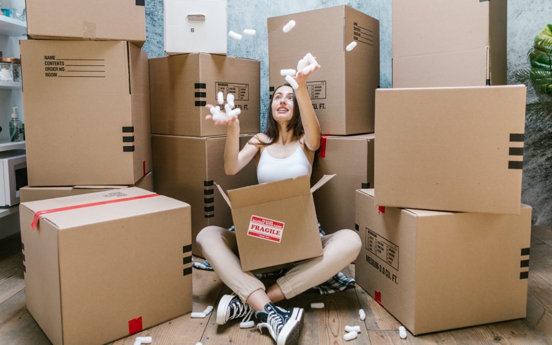 young woman amongst moving boxes