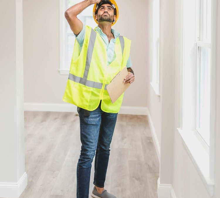 home inspector looking at ceiling