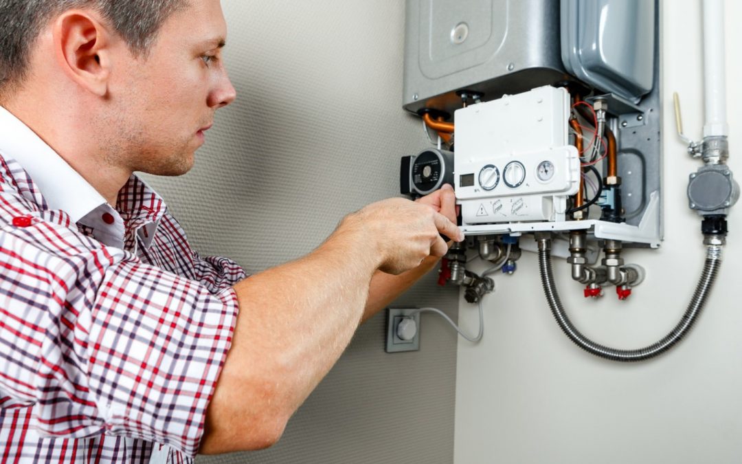 plumber working on water heater