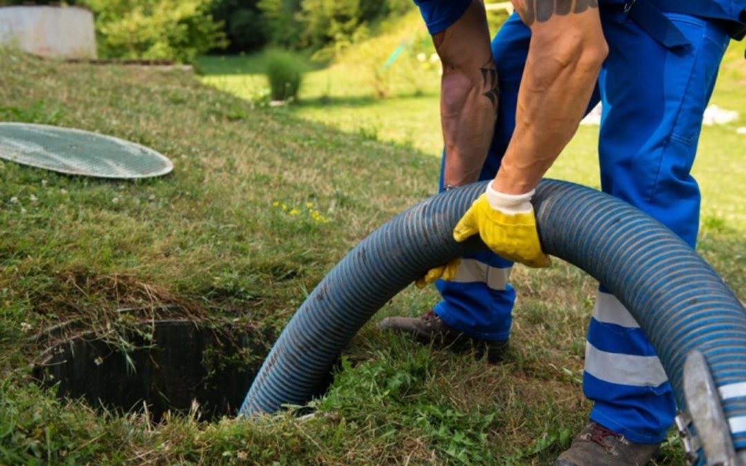 plumber working on sewer drain