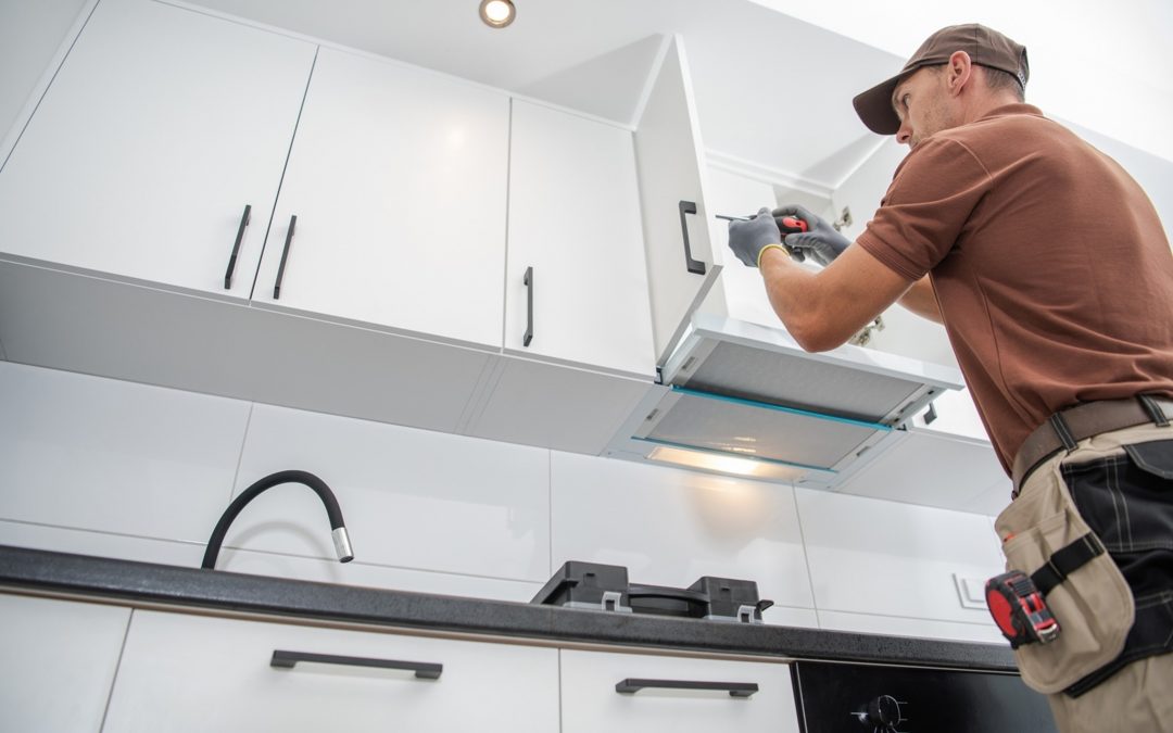 remodelling contractor installing kitchen cabinets