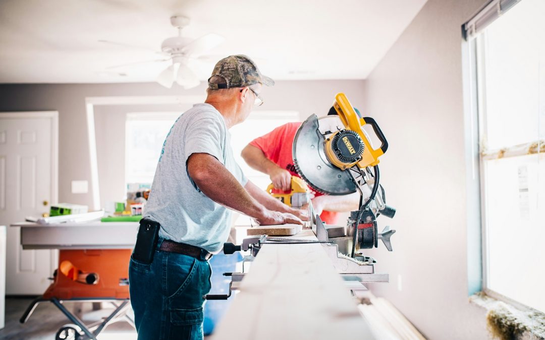 men working on home provement project using tools