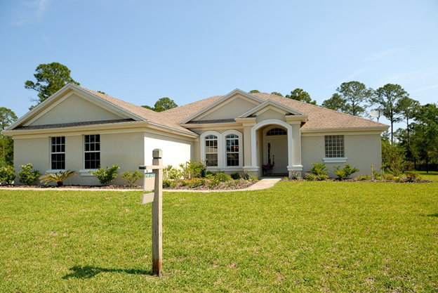 selling house with sign in front