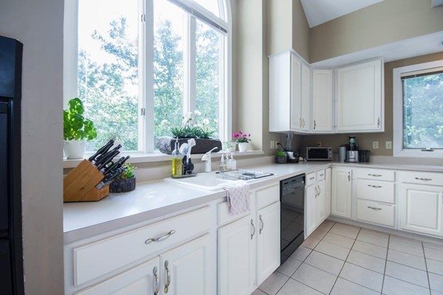 kitchen with large windows letting in sunlight