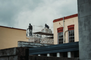 men working on roof repairs