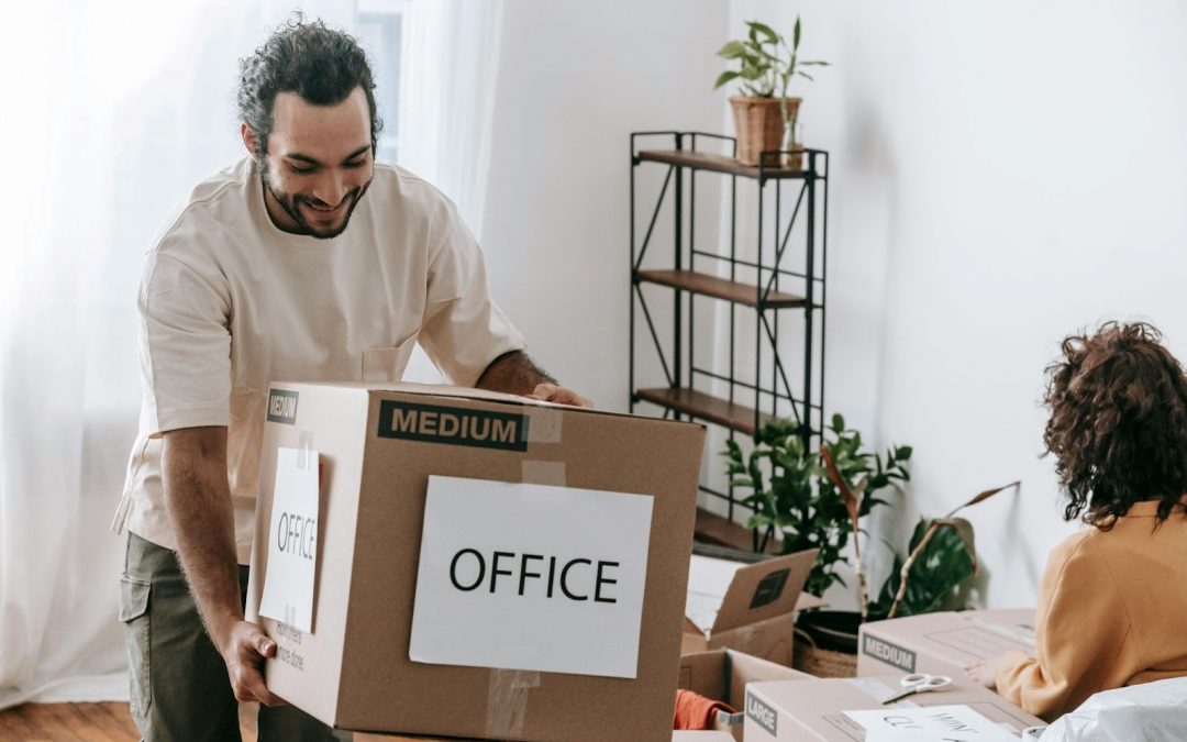 couple packing moving boxes