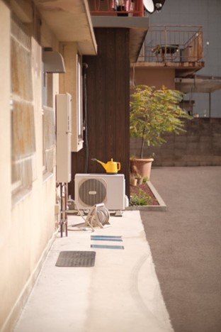 small heat and air conditioning unit outside home