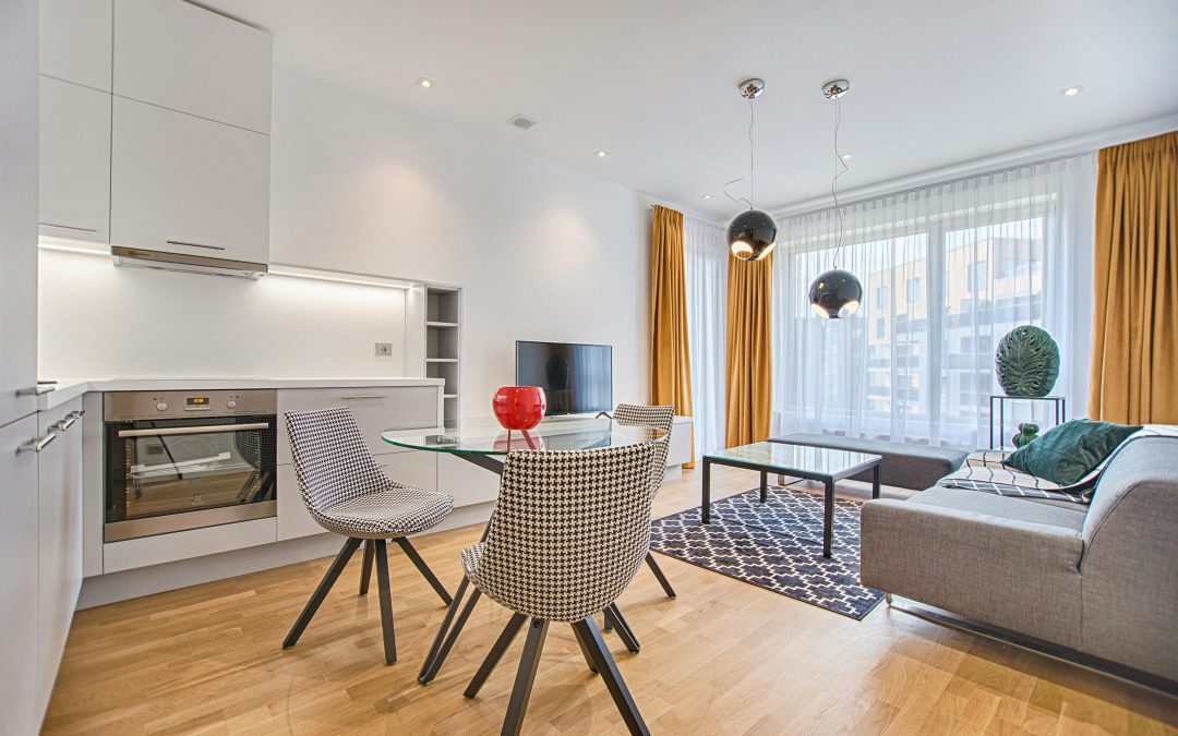 living space with curtains and sheers on window