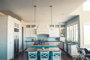 kitchen with nice appliances and light blue furniture