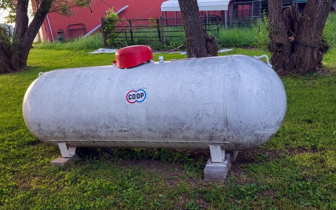 large propane tank on lawn near house