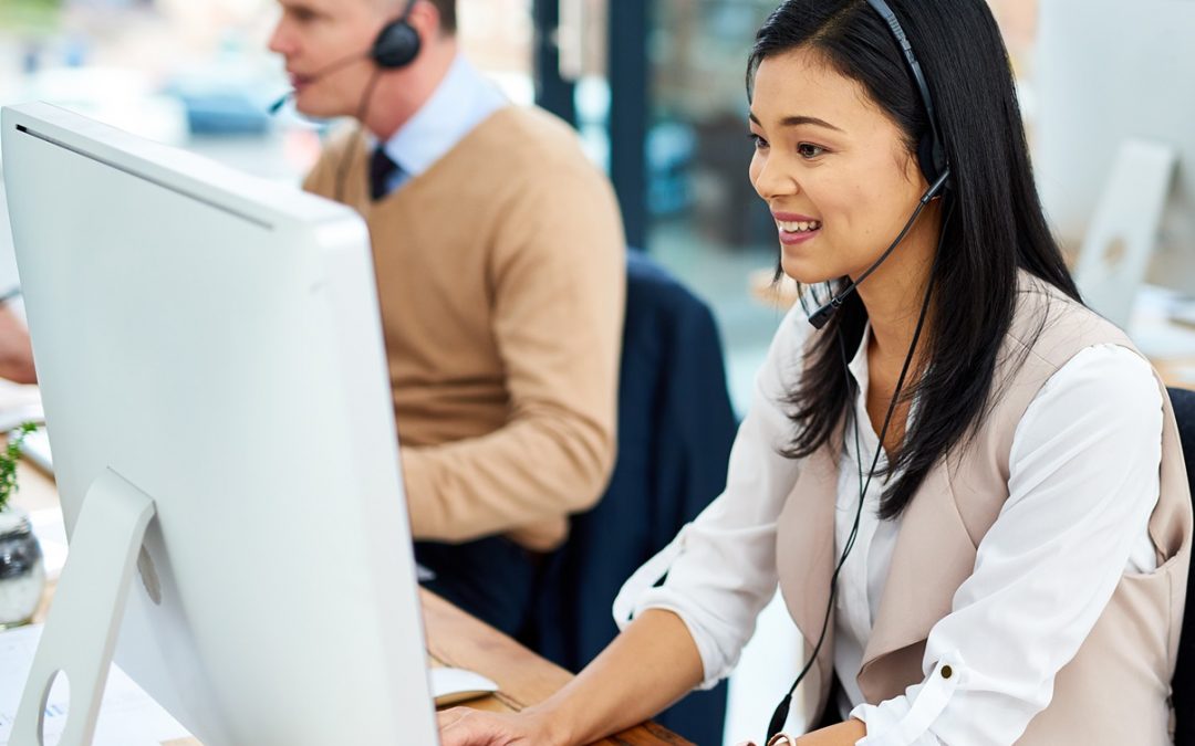 customer service representatives on phone working at computer