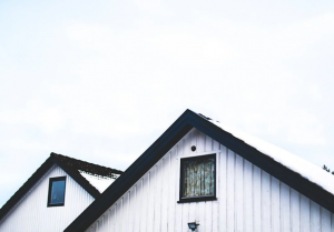 white double peak house with black trim