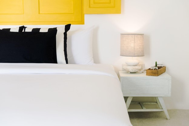 well designed space with white walls and yellow and black accents