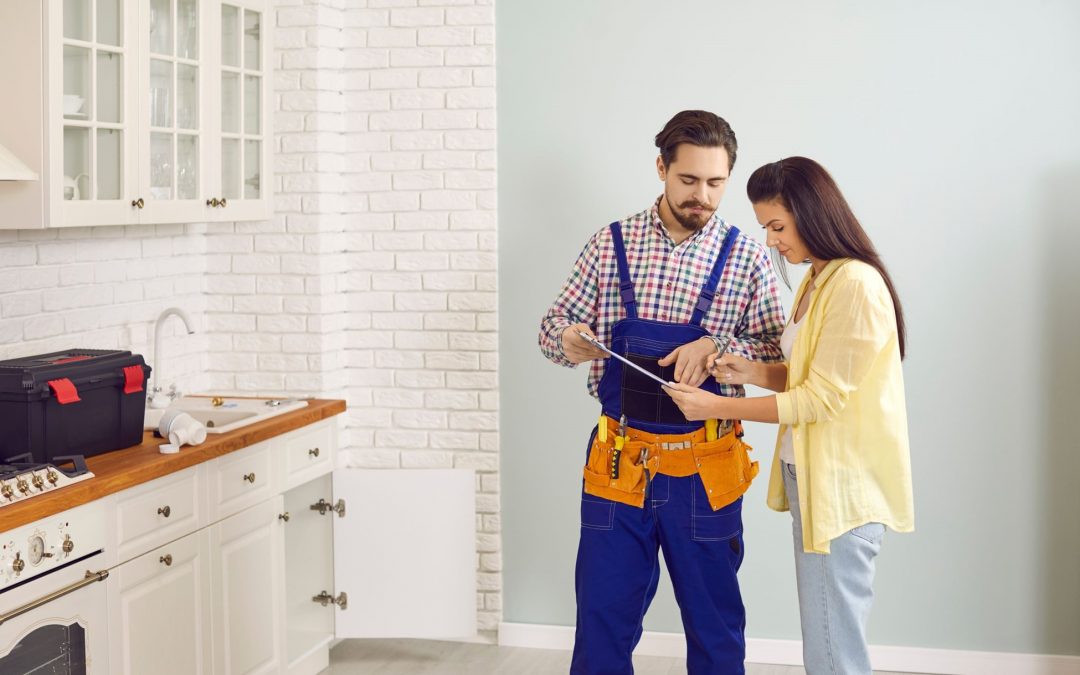 plumbing contractor talking to homeowner