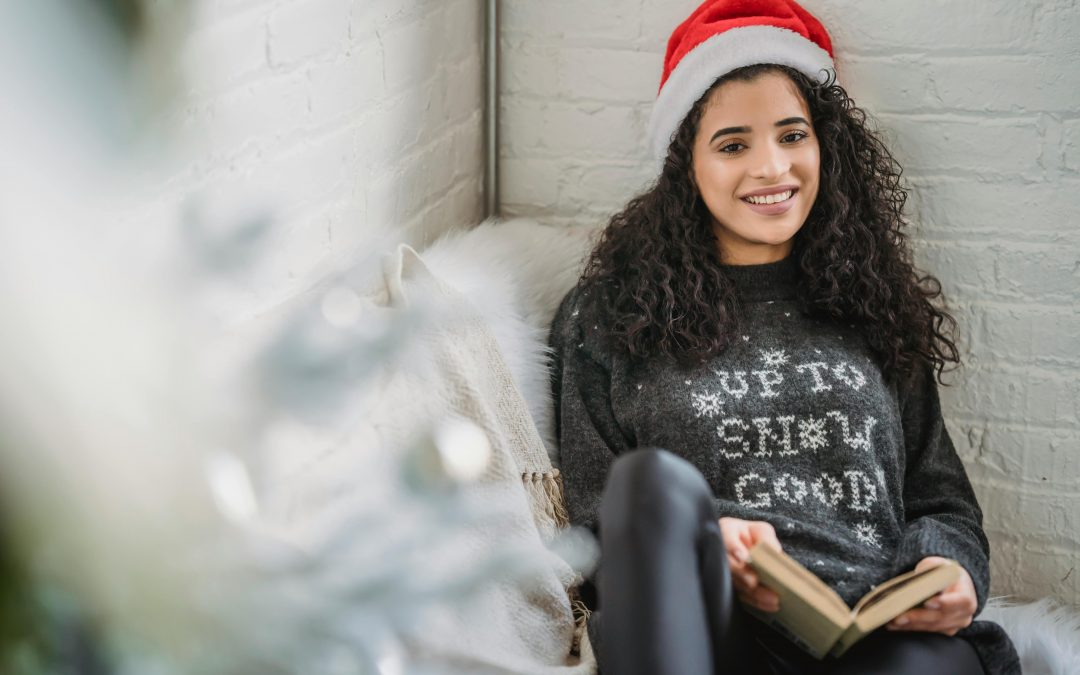 woman reading book in a cozy nook