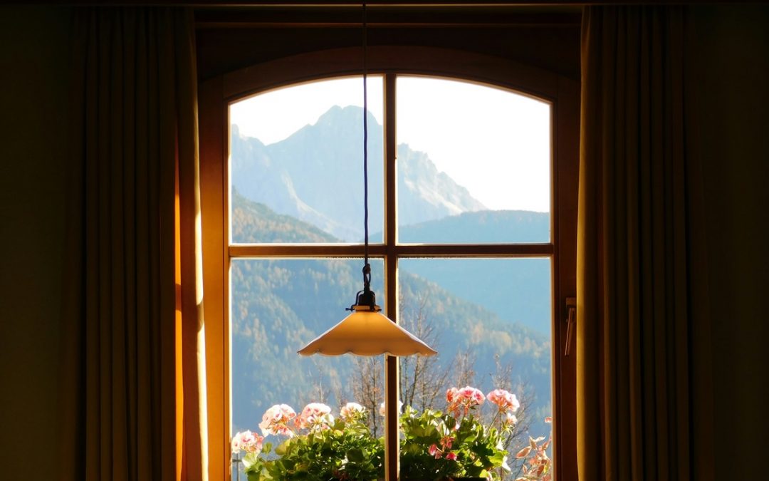 looking through window with view of mountains