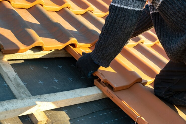 roofer installing tile roof