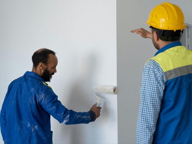 two interior painters working