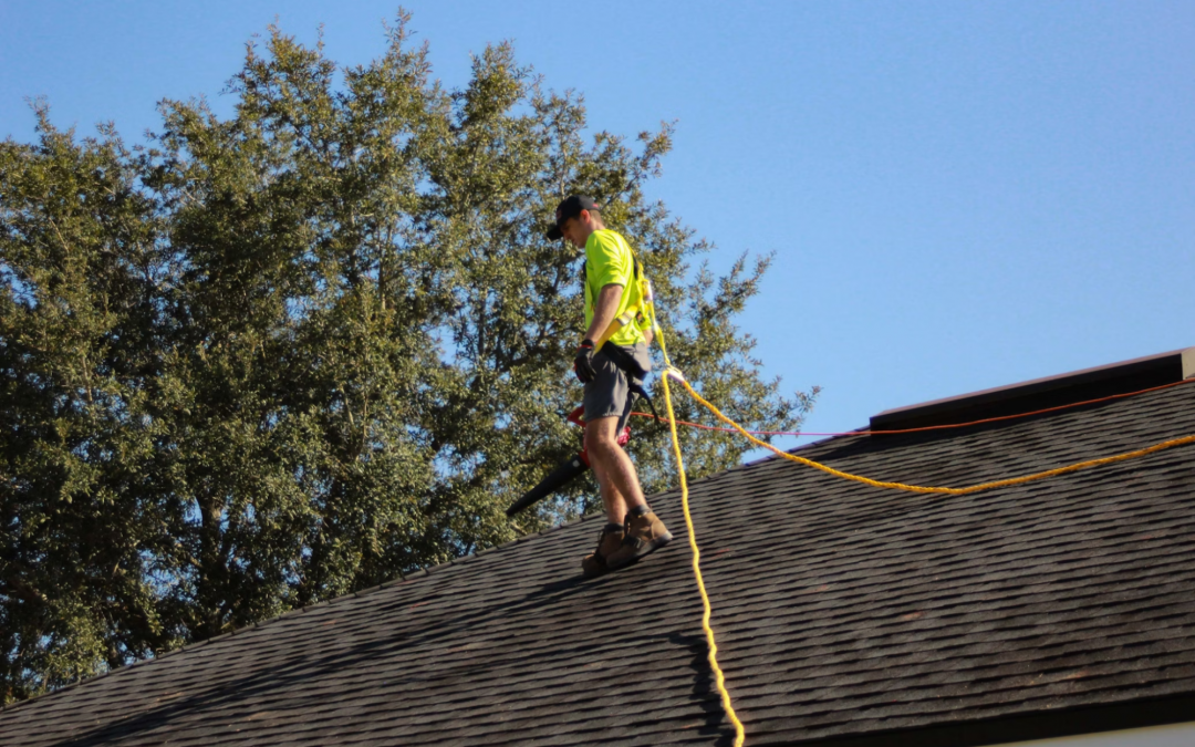 man working on damaged roof