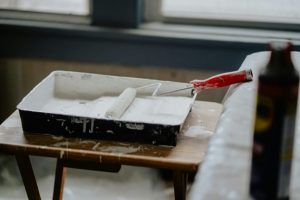 paint and roller on table