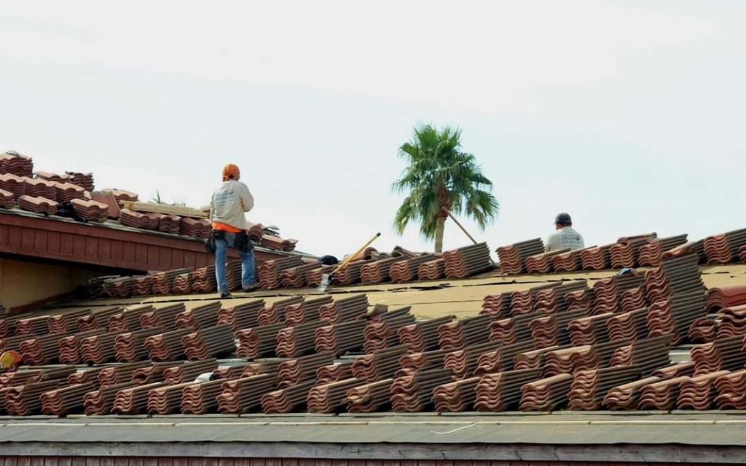 roofers working on tile roof