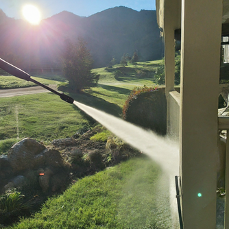 powerwashing house and fence